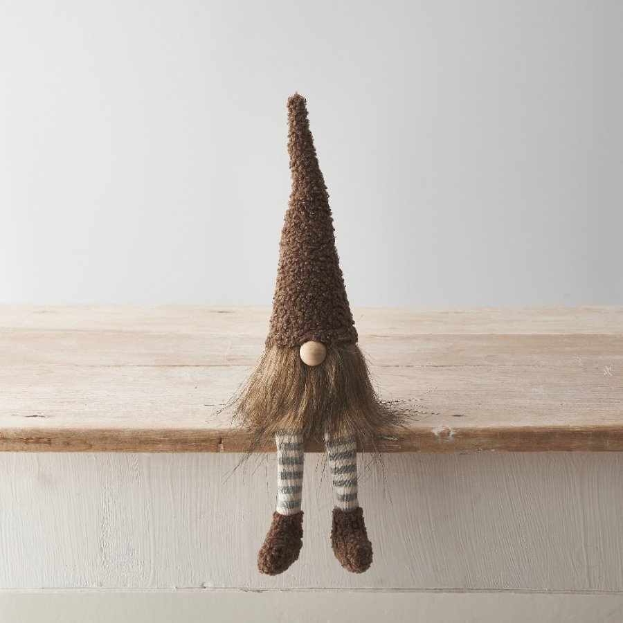 A charming gonk decoration with striped dangly legs, and on trend sherpa fabric hat/shoes.