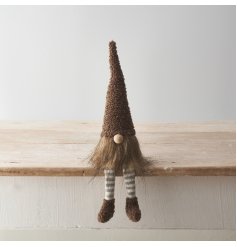 A cute gonk decoration with stylish sherpa fabric hat and shoe details with dangly striped legs. 