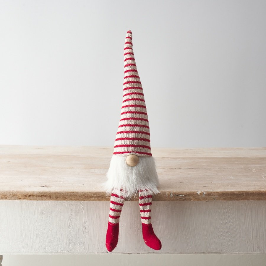 A charming red and white candy cane style gonk decoration with a cute wooden button nose and faux fur beard. 