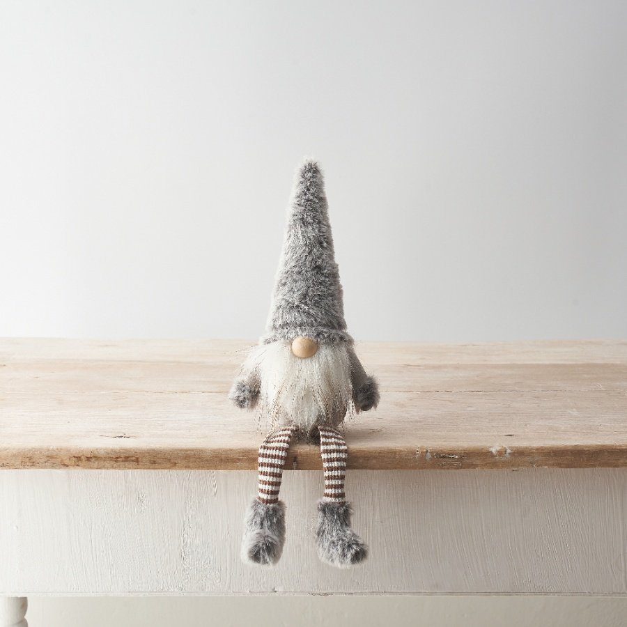 A cute gonk decoration featuring striped dangly legs and faux fur detailing with a stylish grey colour scheme. 