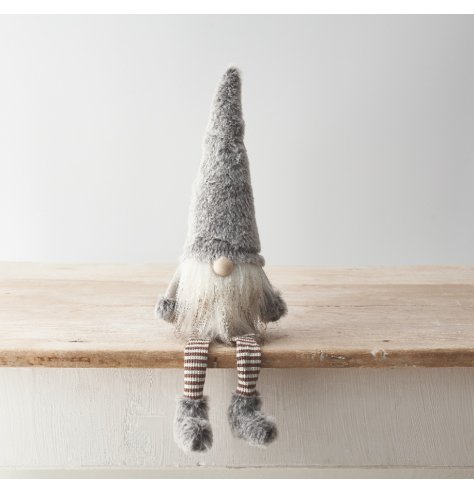 A sweet gonk decoration with striped leg design, grey faux fur details and fluffy beard. 