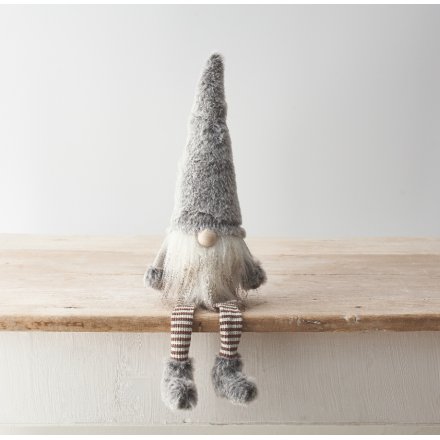 A cute gonk decoration featuring striped dangly legs and faux fur detailing with a stylish grey colour scheme. 