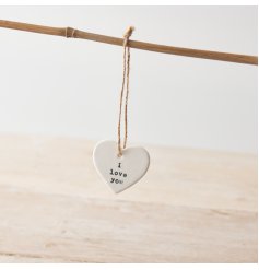 A dainty porcelain hanging heart reading 'i love you'. Complete with jute string hanger. 