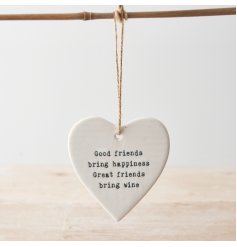 Humorous hanging ceramic heart decoration with message about friendship. 
