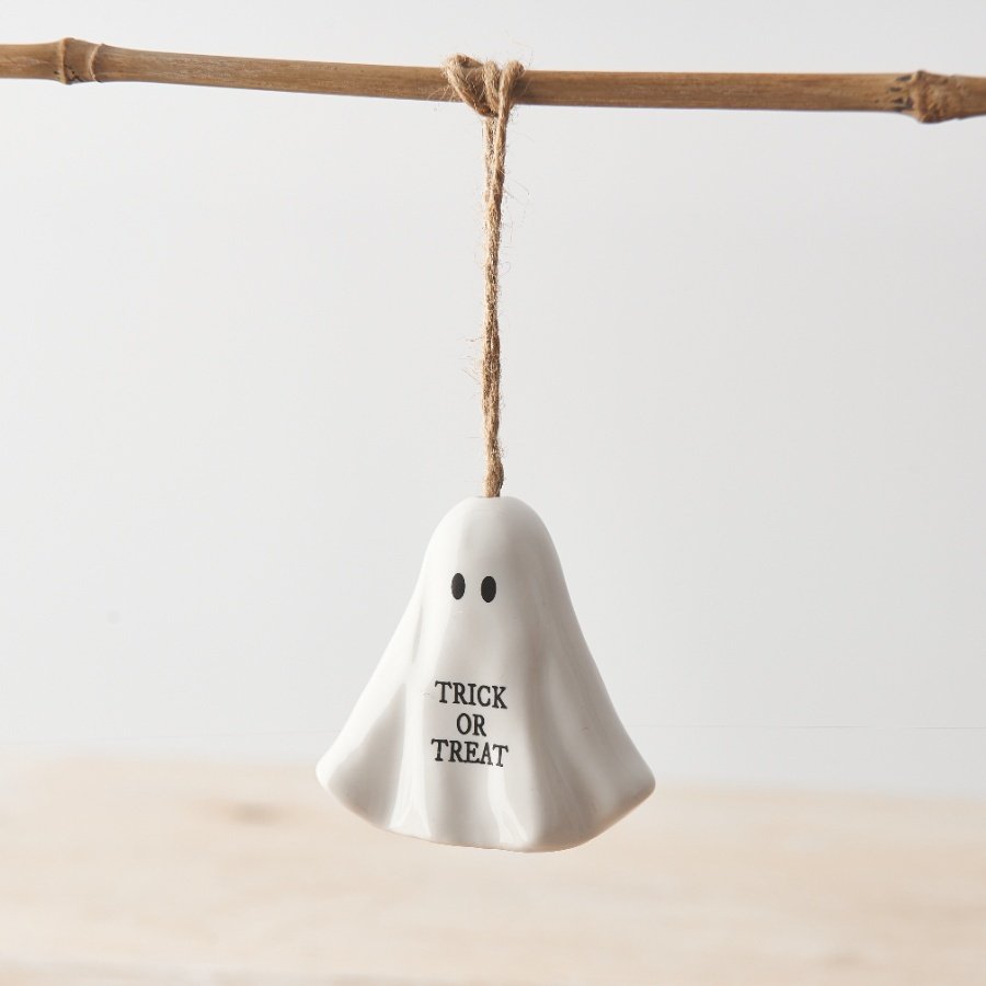 An adorable porcelain ghost decoration with TRICK OR TREAT slogan and rustic jute string hanger. 