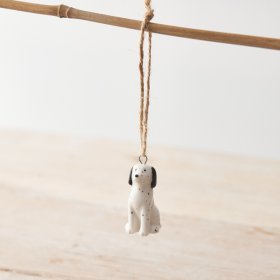 A small porcelain dog hanging decoration featuring a Dalmatian design with monochrome colour scheme and twine hanger. 