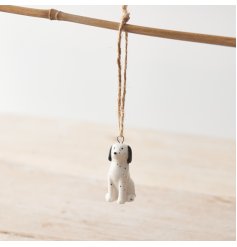 A small porcelain Dalmatian hanging decoration with monochrome design, speckled pattern and twine hanger.  