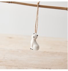 A porcelain cat hanging decoration with a twine hanger, delicate speckled pattern and cute smiling face! 