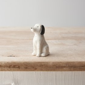 A small porcelain Dalmatian ornament with monochrome design and speckled pattern. 