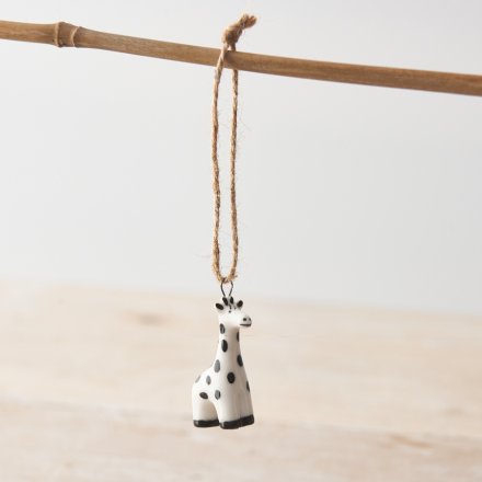 A mini porcelain giraffe hanging decoration with a spotted monochrome design and twine hanger. 