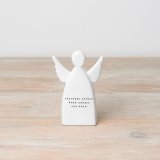 A ceramic ornament with an angel design and "feathers appear when angels are near" message. 