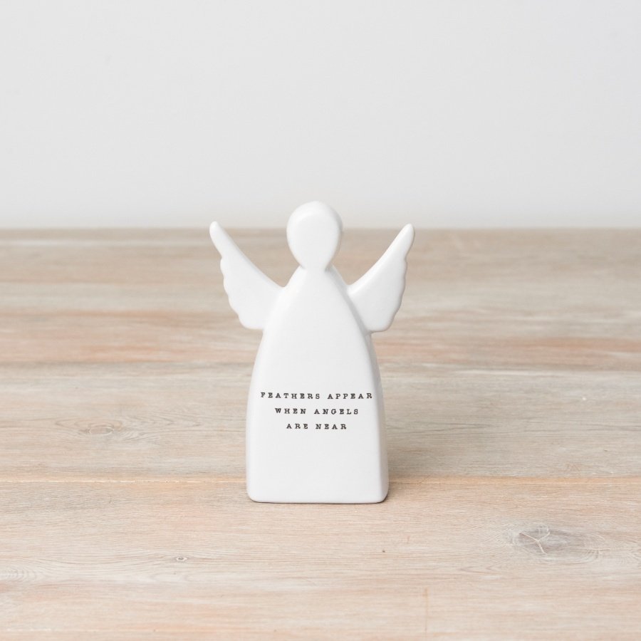 A stylish ceramic ornament with angel design and "feathers appear when angels are near" message.