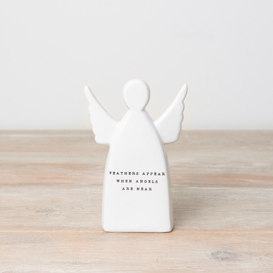 An angel ceramic ornament with "feathers appear when angels are near" wording. 