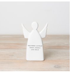 A ceramic ornament with an angel design and "feathers appear when angels are near" message. 