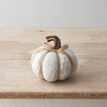 A cute polyresin pumpkin decoration with a knitted effect pattern, chiselled edges and ribbon bow detail. 