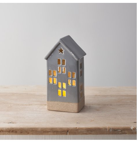 A stylish grey ceramic house with a contrasting textured panel and cut outs including a star design.