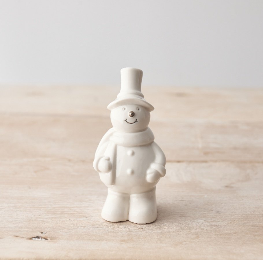 A super sweet little snowman decoration made from porcelain and with silver detailing. 