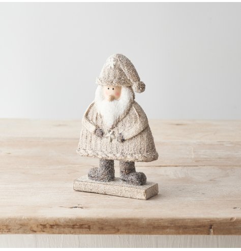 A cute Santa standing Christmas decoration with a glitter finish and stylish neutral colour scheme. 