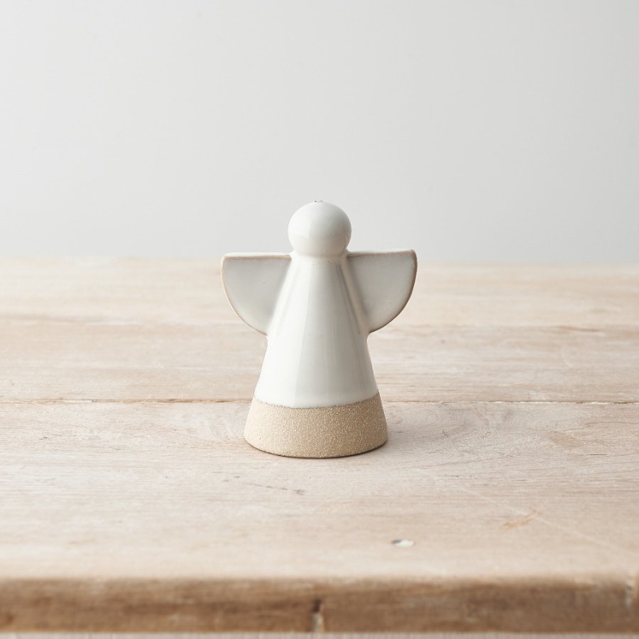 A simple and chic ceramic angel decoration with contrasting coloured edges and base. 