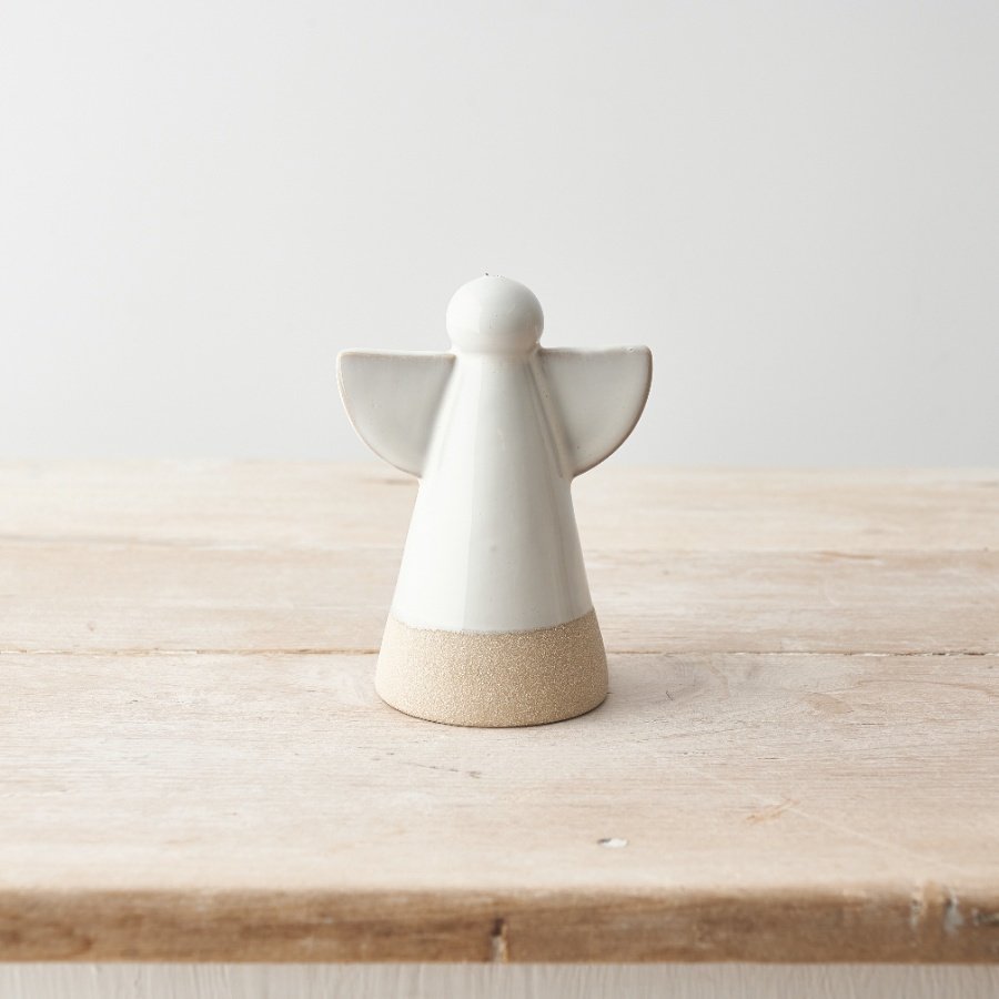 A charming ceramic angel ornament with clean minimal design featuring contrasting edges. 