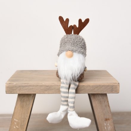 A woodland style gonk decoration with antlers and a sherpa style hat. 