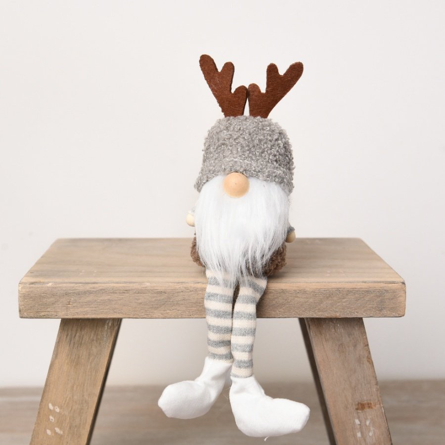 A charming woodland gonk decoration with antlers. Made with beautiful fabrics in a mix of natural colours. 