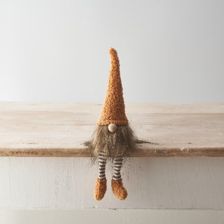 A charming and unique toffee coloured gonk shelf sitter with a textured hat and long faux fur beard. 