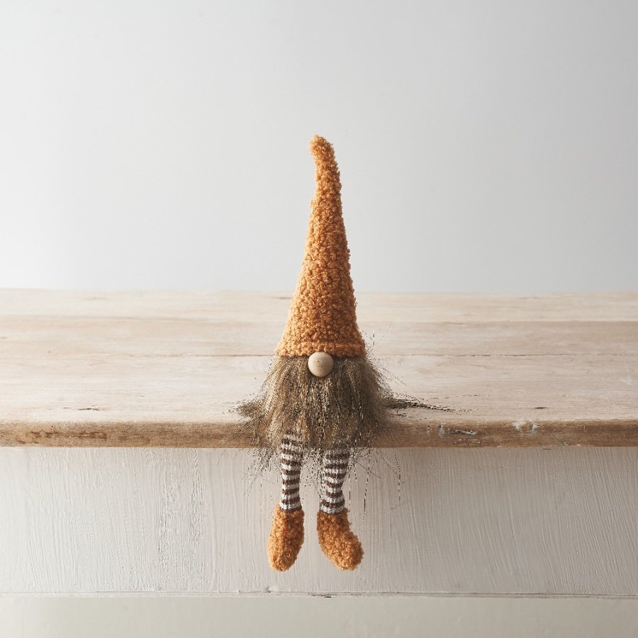 A beautifully textured and coloured shelf sitting gonk with striped legs and a cute wooden nose. 