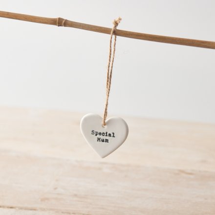 A white ceramic heart hanging decoration with twine hanger and "special Mum" message. 