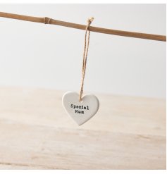 A ceramic heart hanging decoration with "special Mum" message and twine hanger. 