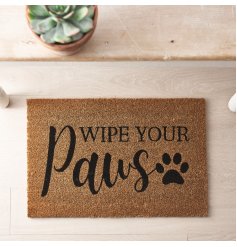 A coir doormat with paw print motif and "wipe your paws".