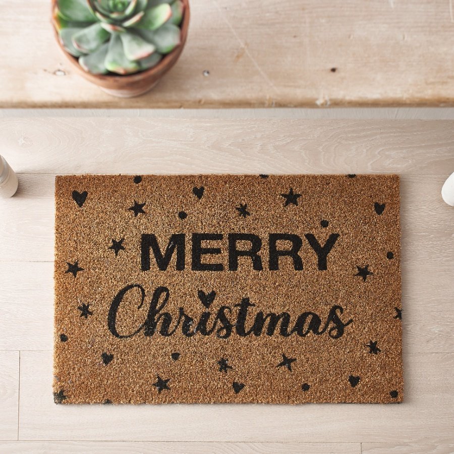 Keep your home free from mud this season with this stylish Merry Christmas slogan doormat with a star and heart design. 