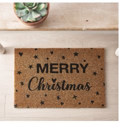 A stylish Merry Christmas door mat with a festive stars and hearts design. Perfect for keeping your home protected 