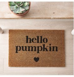 A coir doormat with small heart motif and "hello pumpkin" message. 