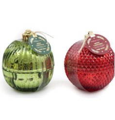 An assortment of 2 scented candles each presented in a metallic patterned bauble pot.