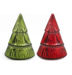 An assortment of 2 scented candles presented within a  patterned glass shaped Christmas tree pot. 