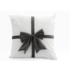 White scatter cushion with 3D bow.