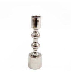 A stylish 16cm silver coloured metal candlestick with a curved pattern design. 