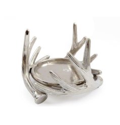 A stylish silver coloured metal candle holder with antler design.