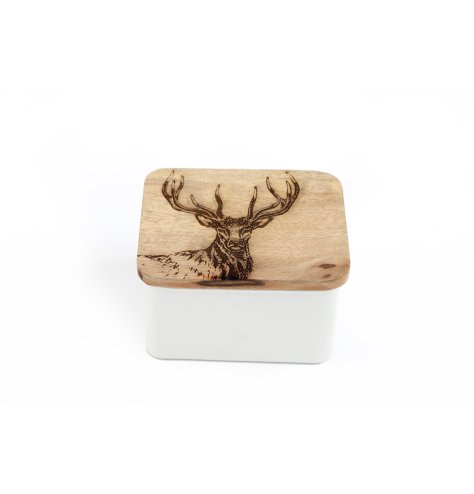 A stylish metal tin with a contrasting wooden lid featuring a stag engraving. 