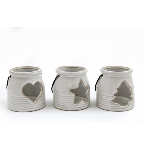 3 Assorted porcelain tea light holders, each with a ribbed pattern, contrasting iron handle and cut out detail. 
