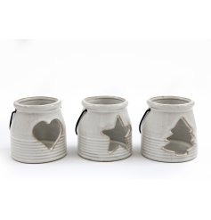 3 Assorted tea light holders, each with a stylish ribbed porcelain design, cut out detail and black iron handle. 