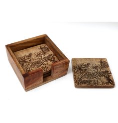A set of 4 natural wooden coasters with holder. Each has an intricate laser cut floral and robin design.