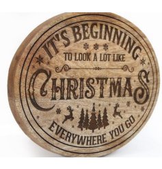 It's beginning to look a lot like Christmas. A natural wooden board with an intricate laser cut design.