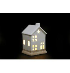 A stylish porcelain house decoration with LED light up features and star design detail. 