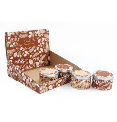 An assortment of 2 scented candles presented in a cute tin decorated with Winter foliage. 