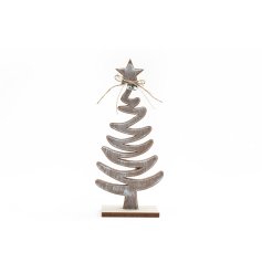 A stylish wooden decoration featuring a Christmas tree design with twine string bow and bell embellishments. 
