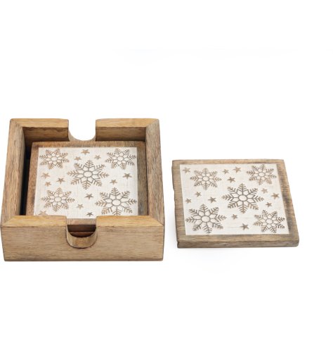 A gorgeous set of 4 rustic wooden coasters, detailed with snowflakes and stars