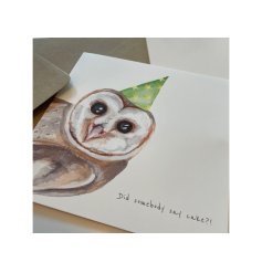 An illustrated greeting card with a cute owl design and "did somebody say cake?" text. 