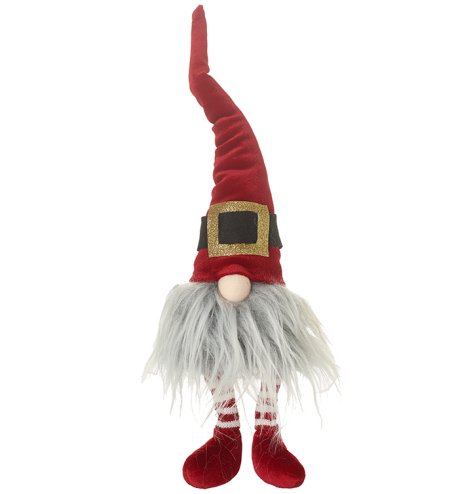 A red sitting gonk with Santa's belt around his hat and long dangly legs.